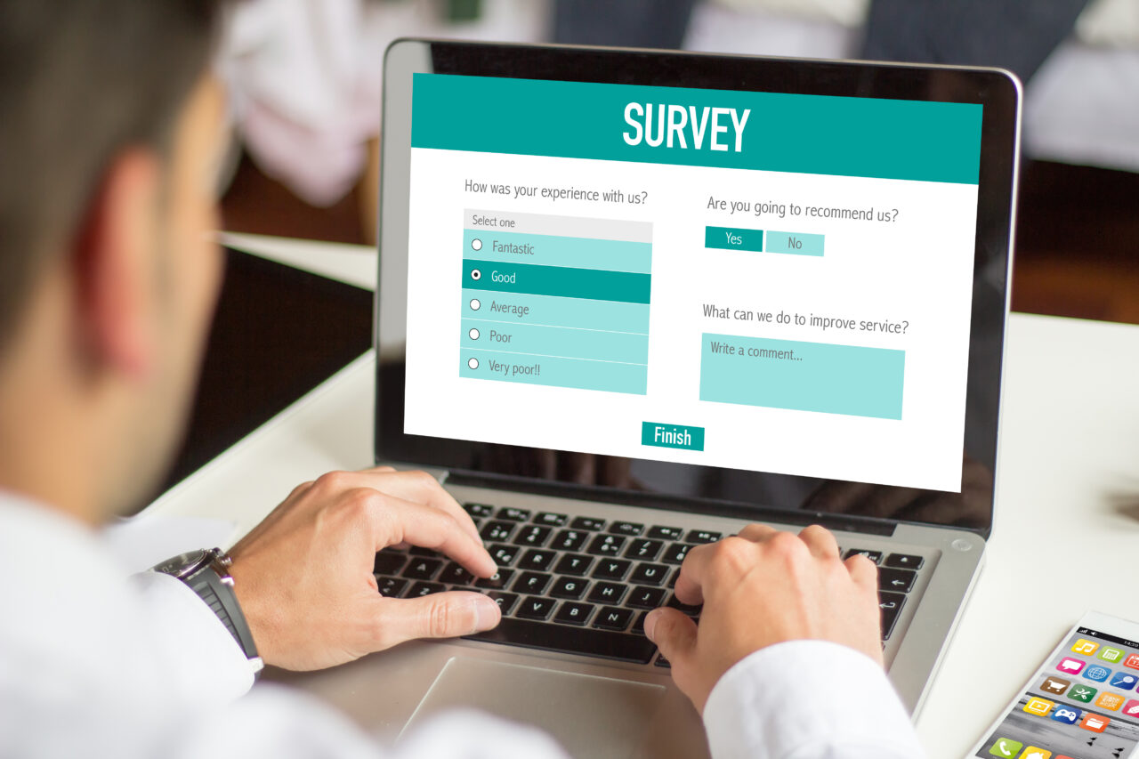 Businessman filling a online customer service satisfaction survey