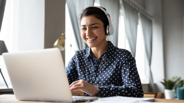 Smiling girl wearing headphones